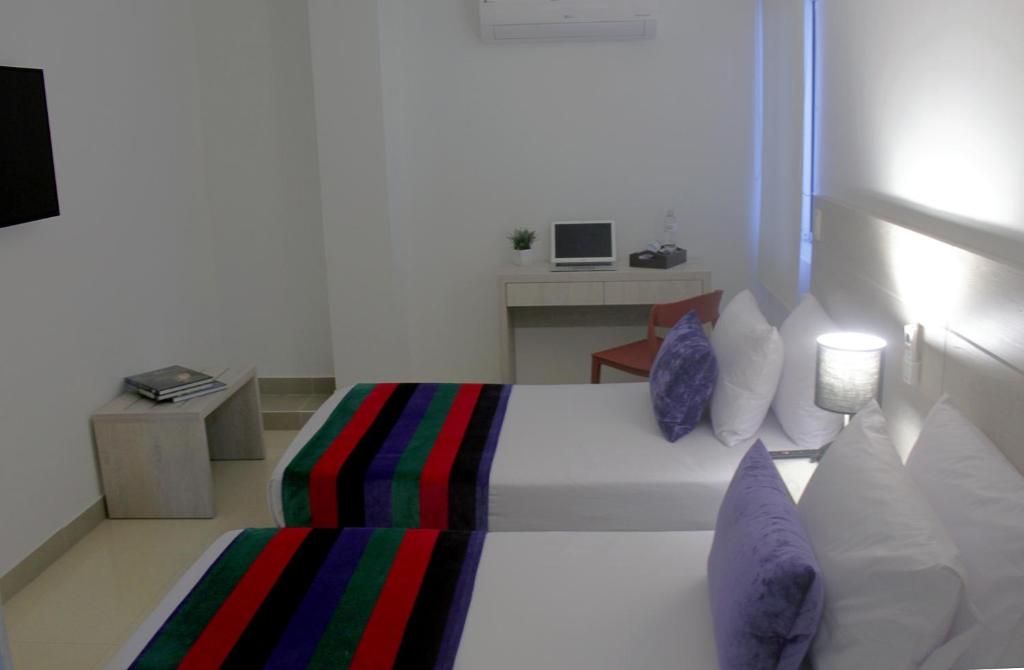 Postel nebo postele na pokoji v ubytování Hotel Suite Comfort