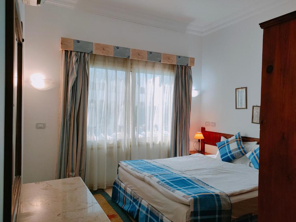 Postel nebo postele na pokoji v ubytování 4S Hotel Dahab