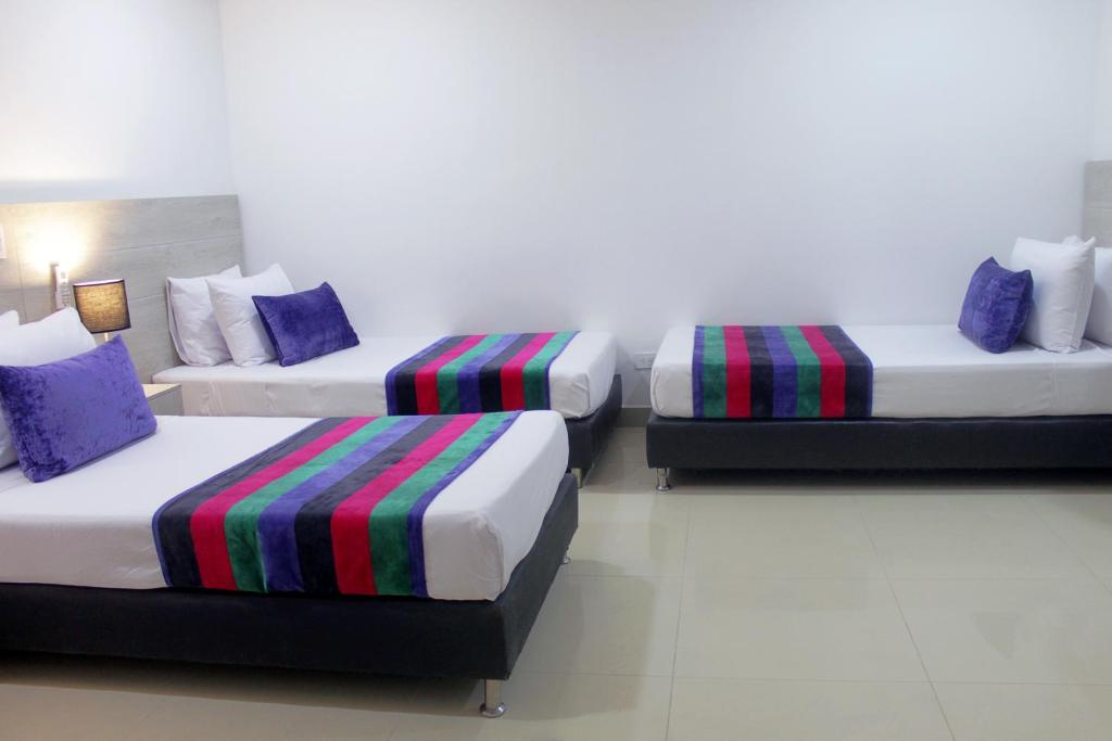 Postel nebo postele na pokoji v ubytování Hotel Suite Comfort