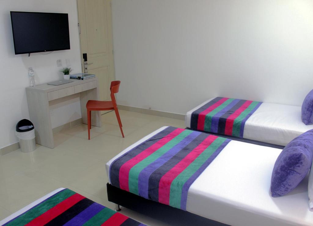 TV a/nebo společenská místnost v ubytování Hotel Suite Comfort