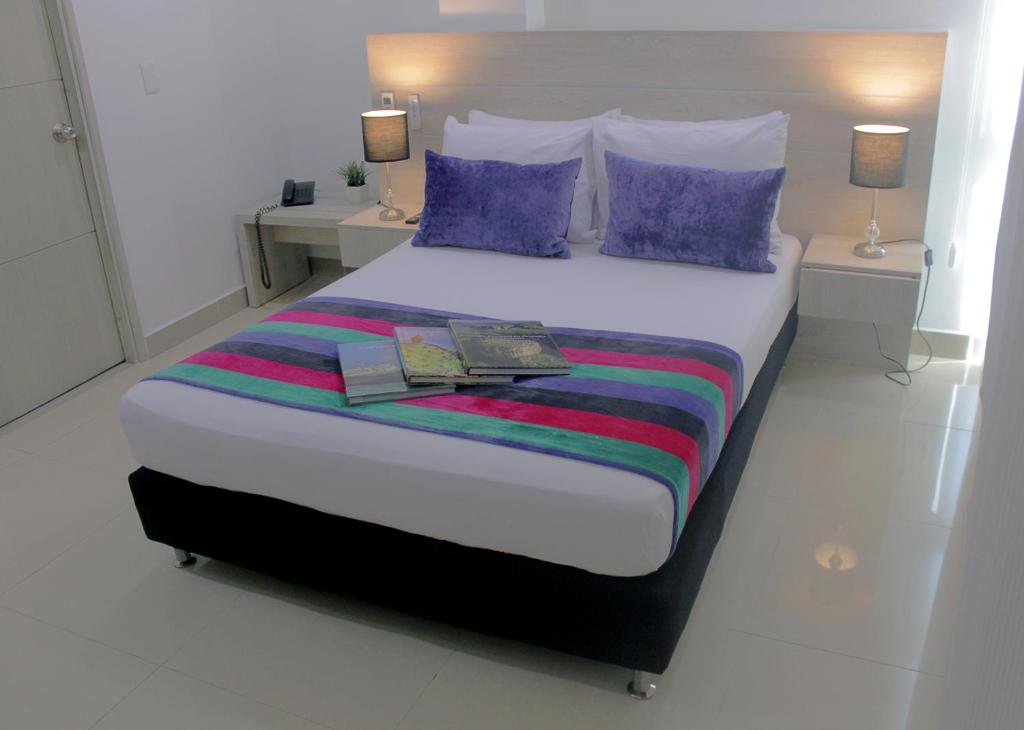 Postel nebo postele na pokoji v ubytování Hotel Suite Comfort