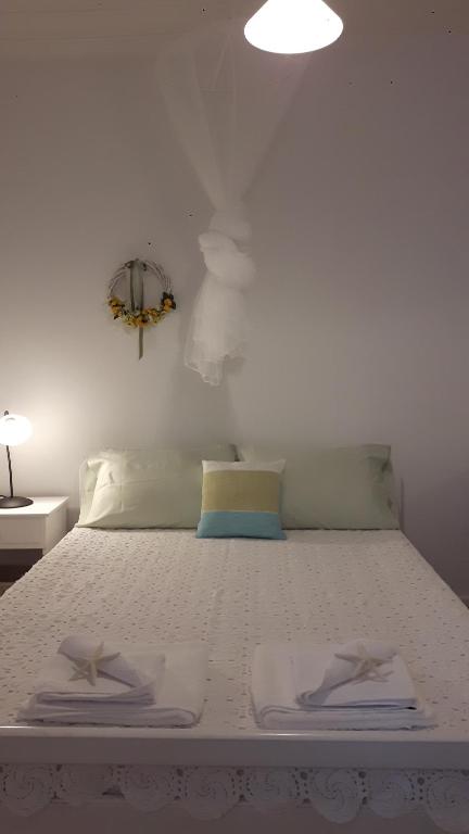 Postel nebo postele na pokoji v ubytování Cavos Seaside House