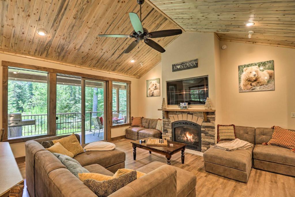 a living room with a couch and a fireplace at Bigfork Modern Living - Pet and Family Friendly! in Bigfork