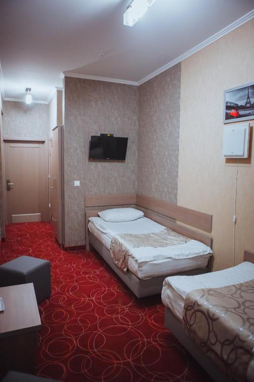 Postel nebo postele na pokoji v ubytování Magnum
