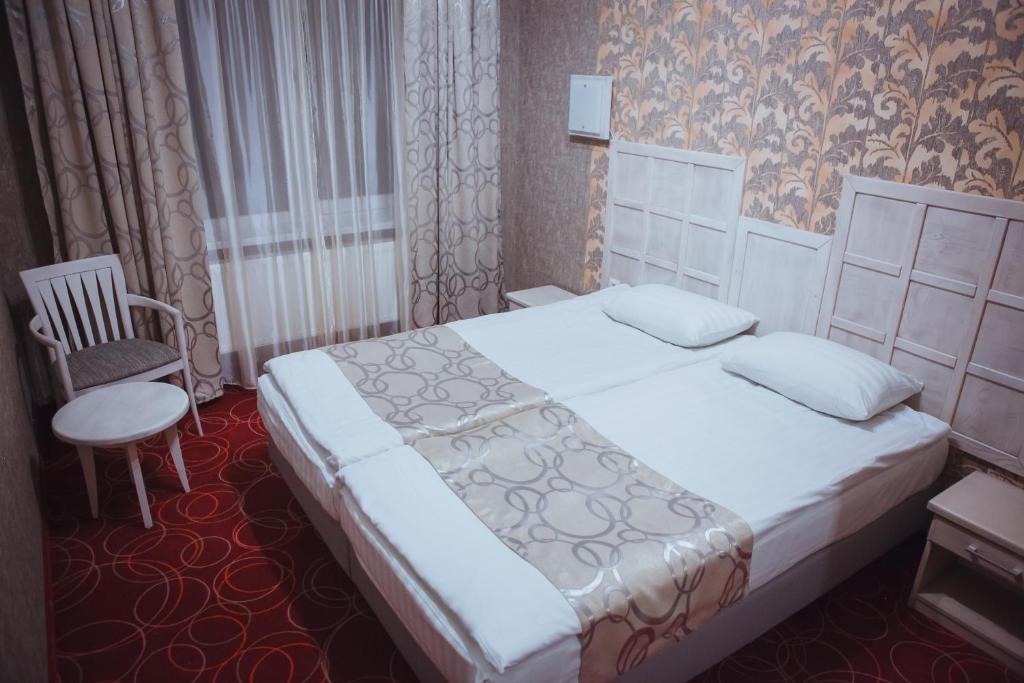 Postel nebo postele na pokoji v ubytování Magnum