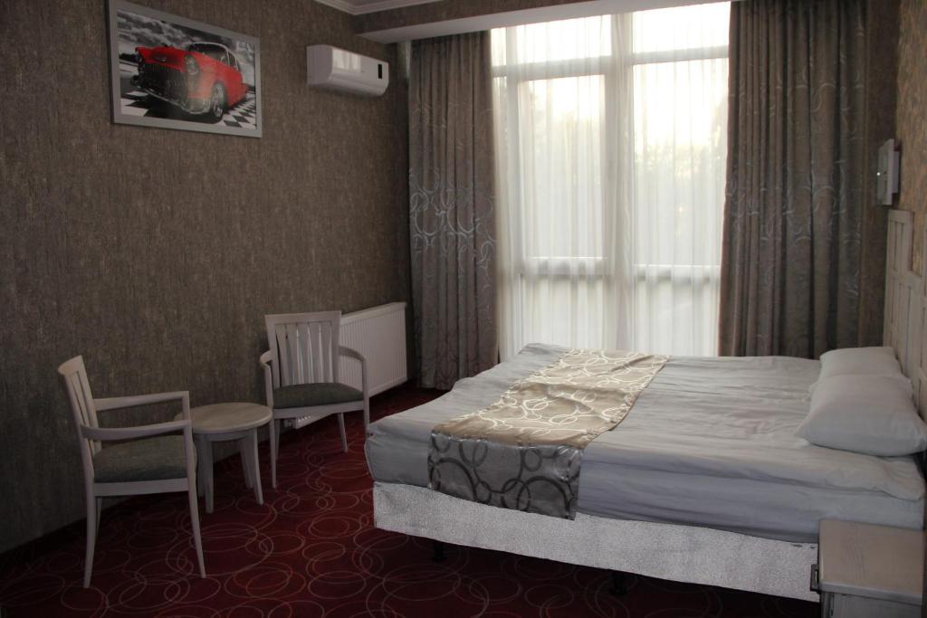 Postel nebo postele na pokoji v ubytování Magnum