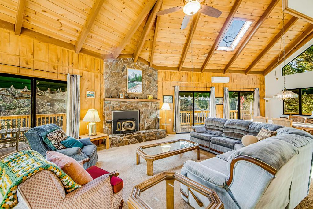 a large living room with couches and a fireplace at Luring Lakefront Landing in Groveland