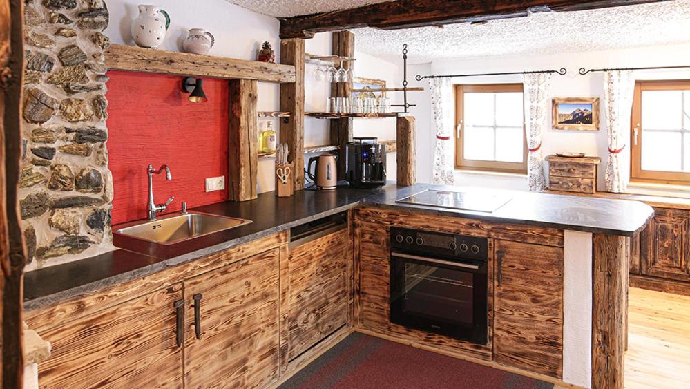 A kitchen or kitchenette at Landhaus Sommerbichl