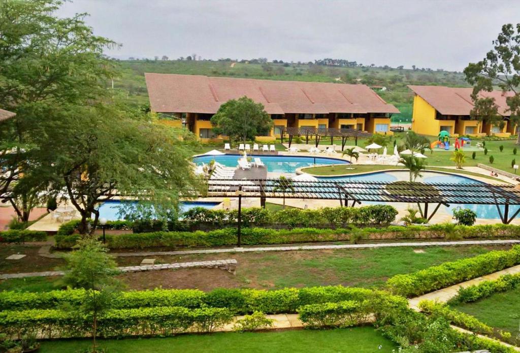 a view of a resort with two swimming pools at Gravatá - Condomínio Winterville in Gravatá