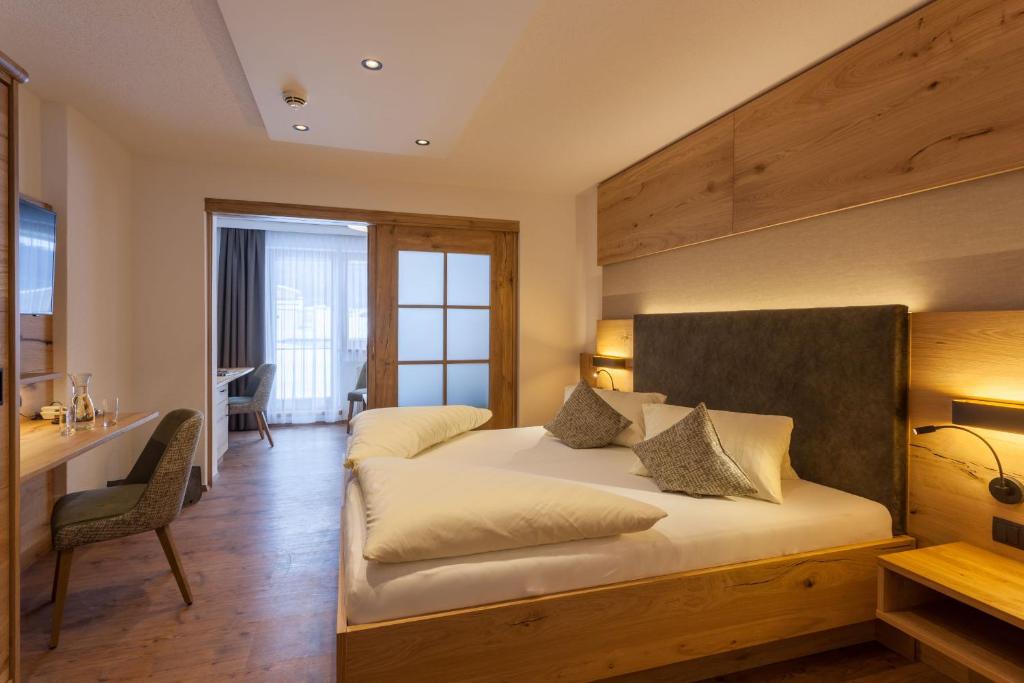 Ein Bett oder Betten in einem Zimmer der Unterkunft Hotel Luggi