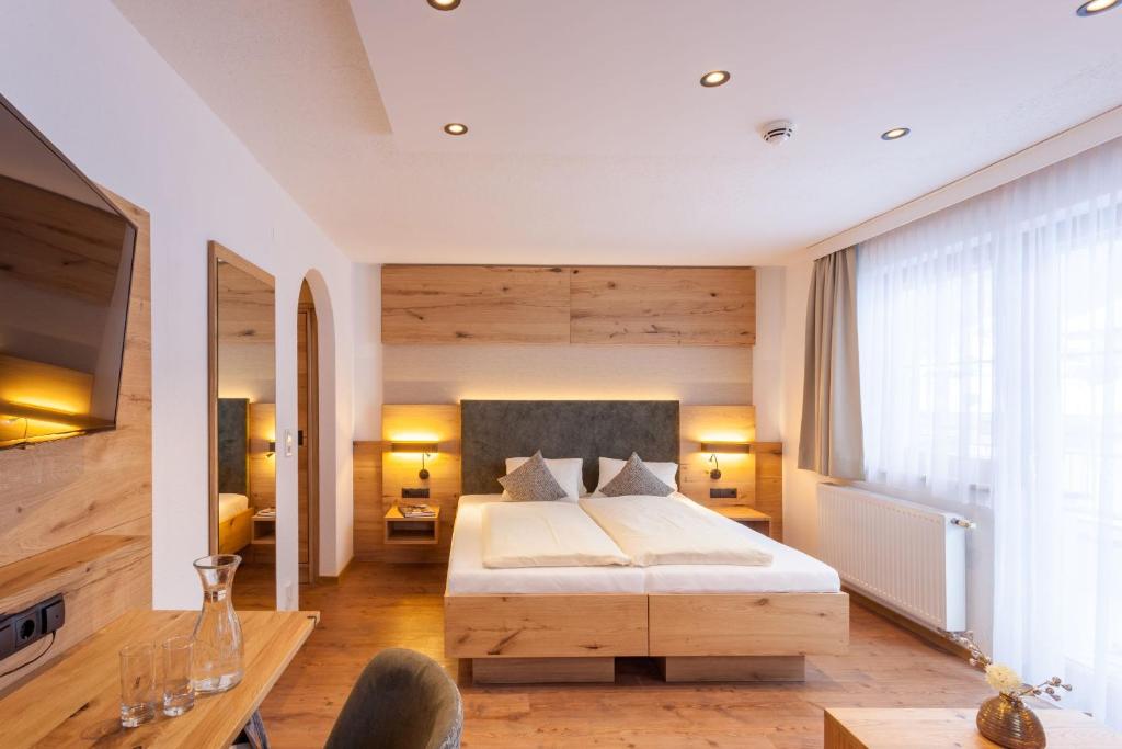 Ein Bett oder Betten in einem Zimmer der Unterkunft Hotel Luggi