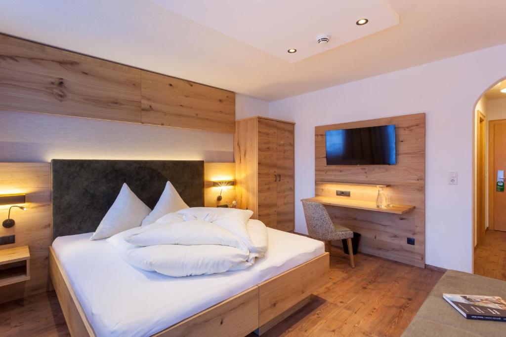 Ein Bett oder Betten in einem Zimmer der Unterkunft Hotel Luggi