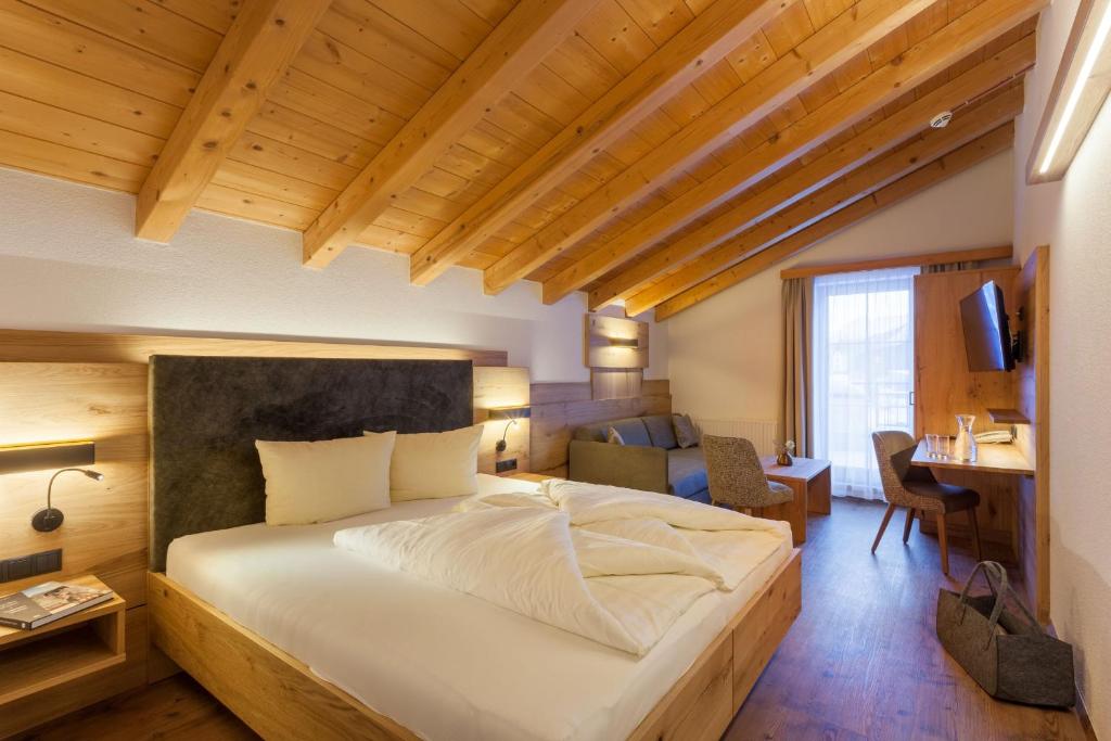 Ein Bett oder Betten in einem Zimmer der Unterkunft Hotel Luggi
