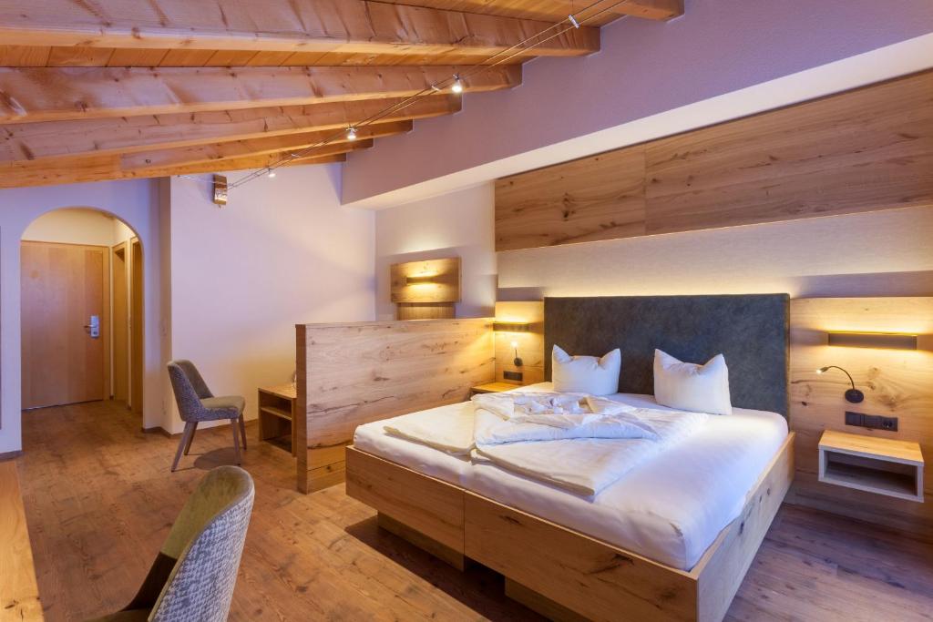 Ein Bett oder Betten in einem Zimmer der Unterkunft Hotel Luggi