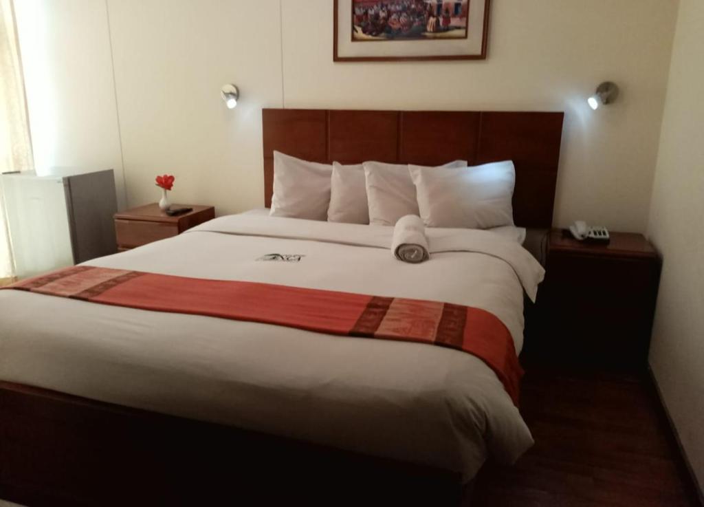 Postel nebo postele na pokoji v ubytování Golden Inca Hotel