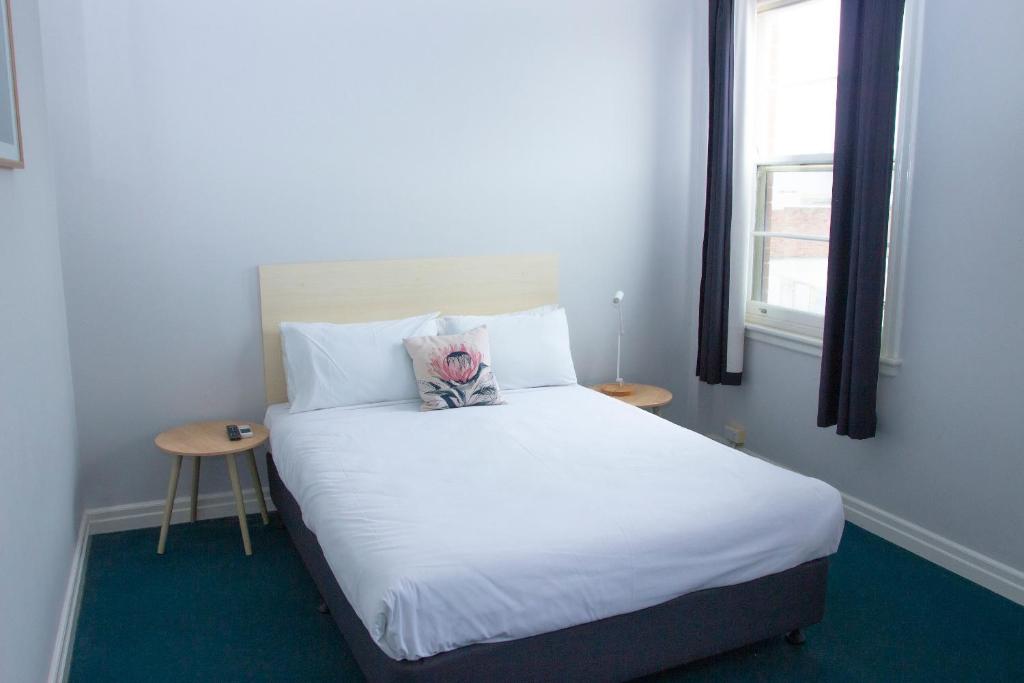 Postel nebo postele na pokoji v ubytování Grand Hotel Rockdale