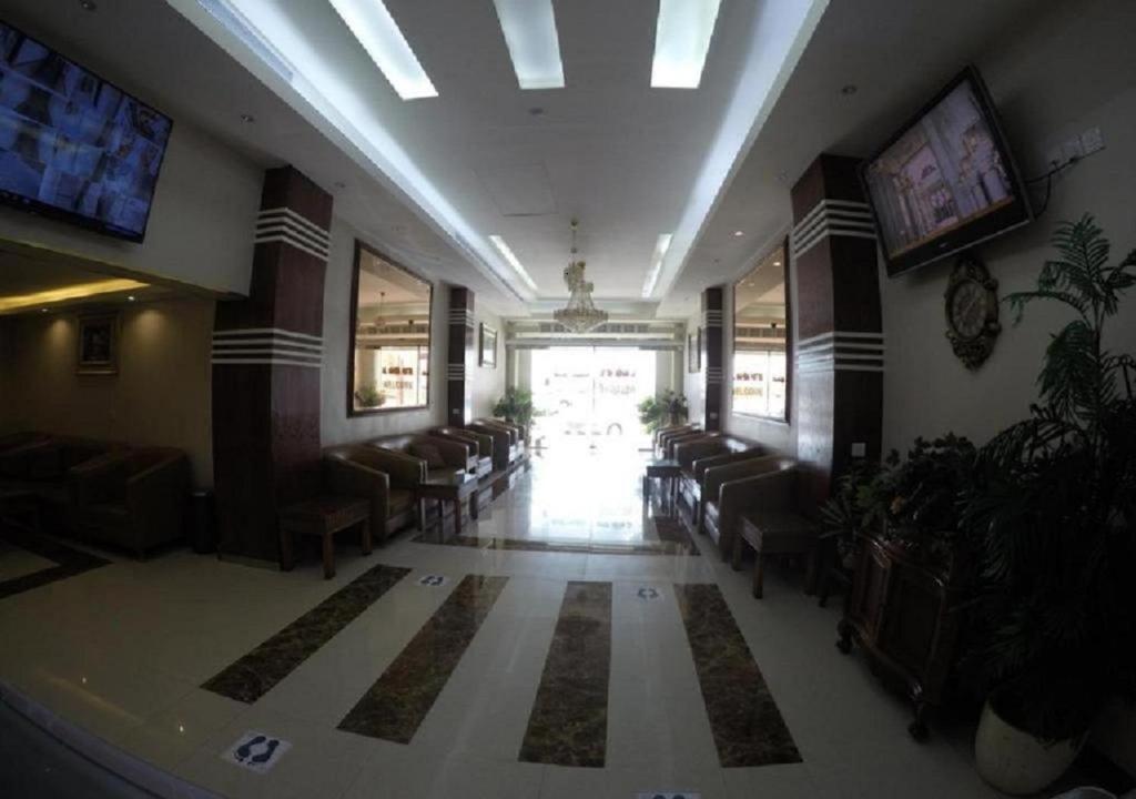 a lobby with a waiting room with chairs and a window at Al Nahda Urban Company Residential Units in Jeddah