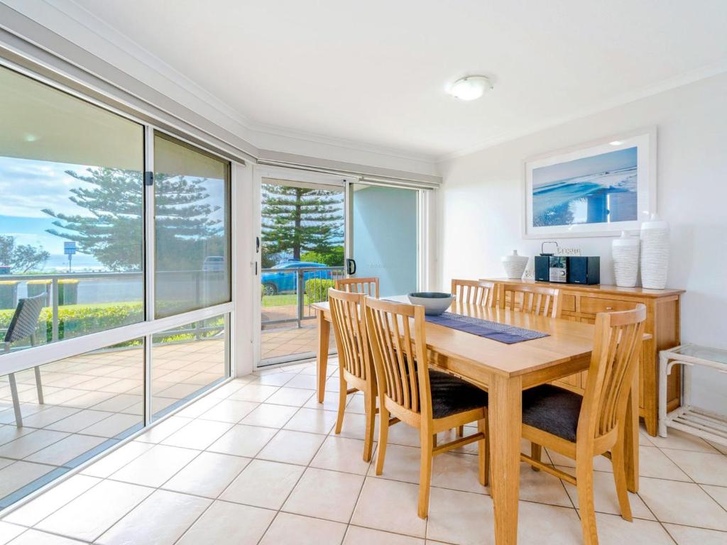 a dining room with a table and chairs at Blue Pacific 2 in Yamba