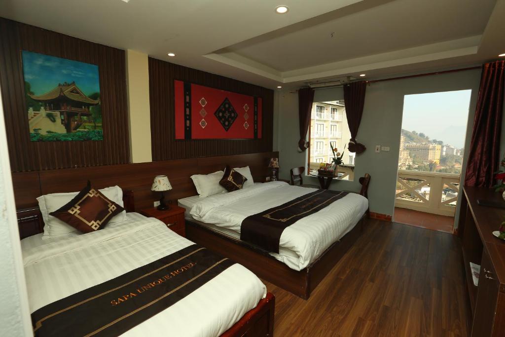 Postel nebo postele na pokoji v ubytování Sapa Unique Hotel