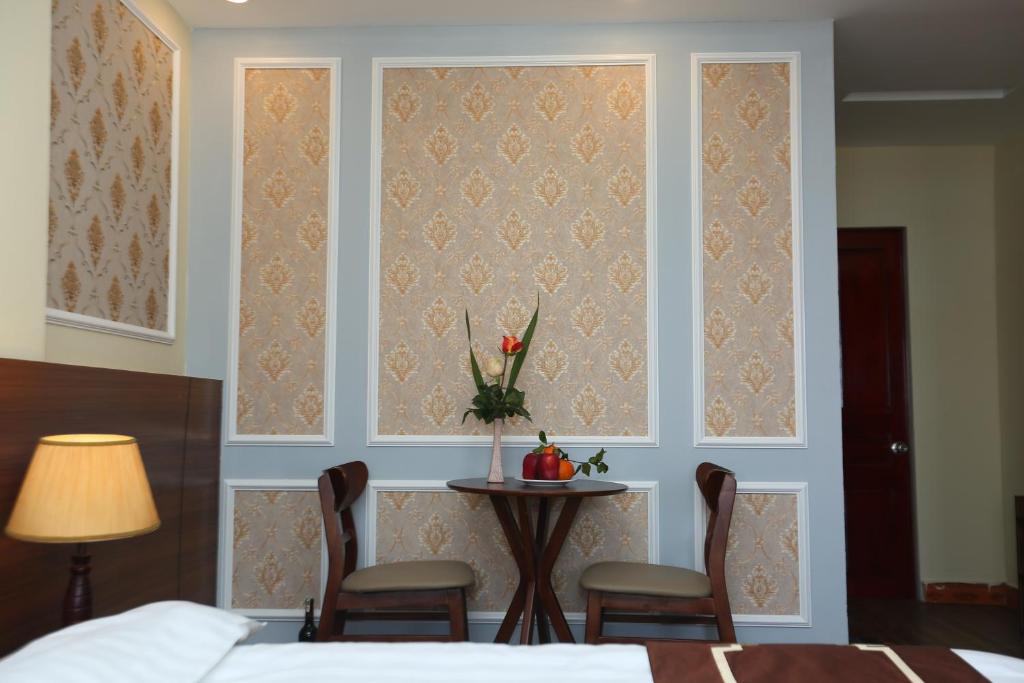 Postel nebo postele na pokoji v ubytování Sapa Unique Hotel