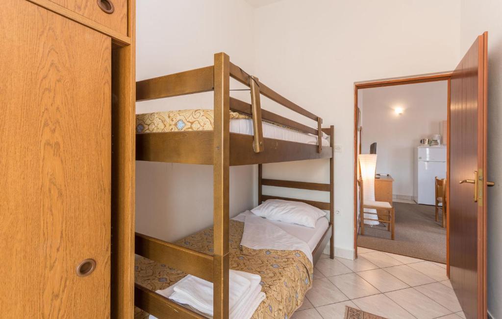Łóżko lub łóżka w pokoju w obiekcie Apartments Anchor