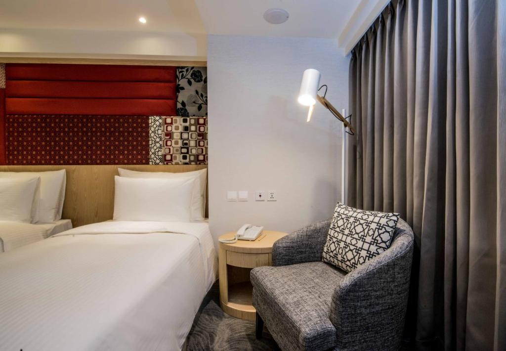 Postel nebo postele na pokoji v ubytování Sonnien Hotel