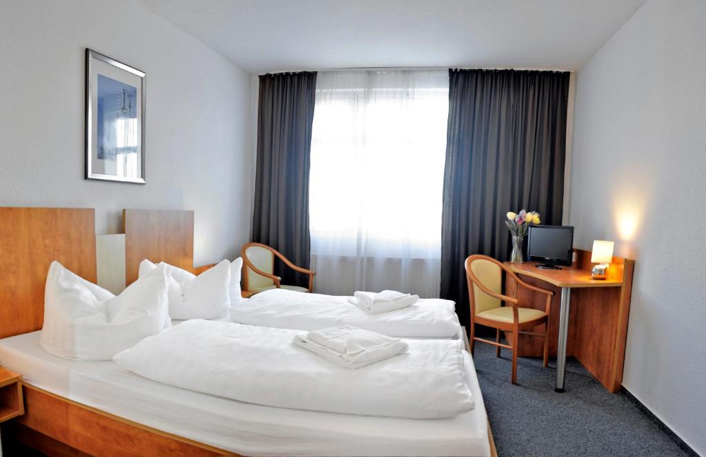 Postel nebo postele na pokoji v ubytování Apart Hotel Ferdinand Berlin