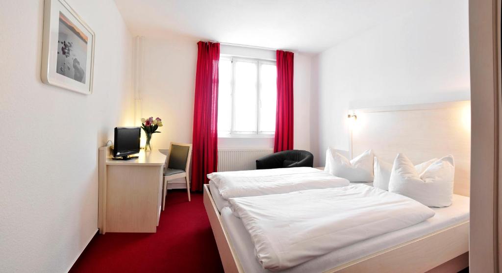 Postel nebo postele na pokoji v ubytování Apart Hotel Ferdinand Berlin