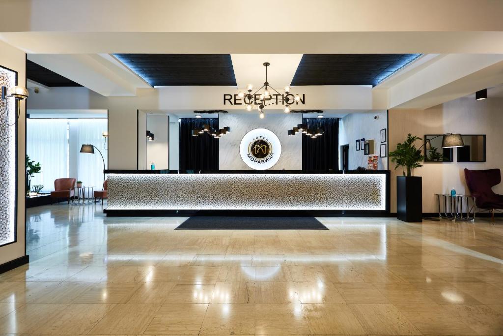 a lobby with a reception desk in a building at Hotel Moravica in Soko Banja