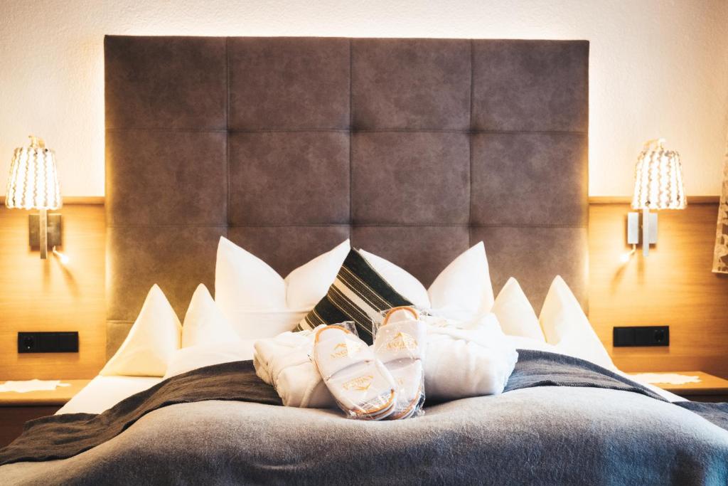 Postel nebo postele na pokoji v ubytování Hotel Garni Angela