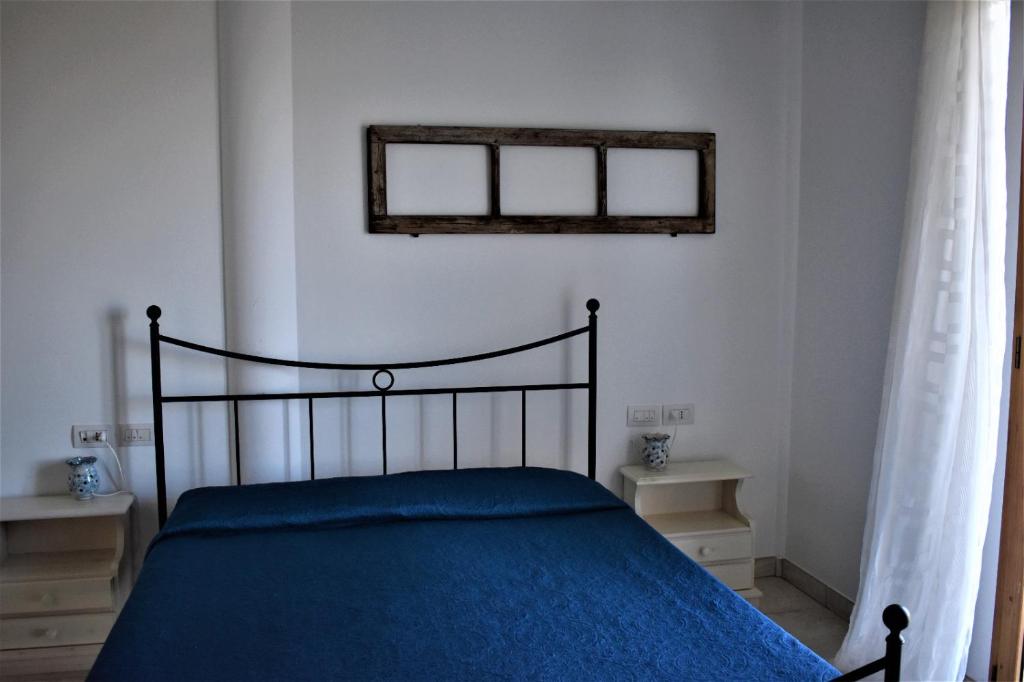 Postel nebo postele na pokoji v ubytování Casolare Azzurro