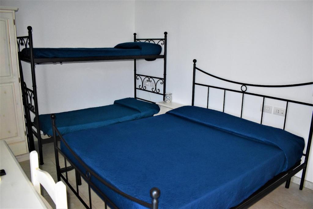 Postel nebo postele na pokoji v ubytování Casolare Azzurro