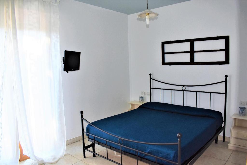 Postel nebo postele na pokoji v ubytování Casolare Azzurro