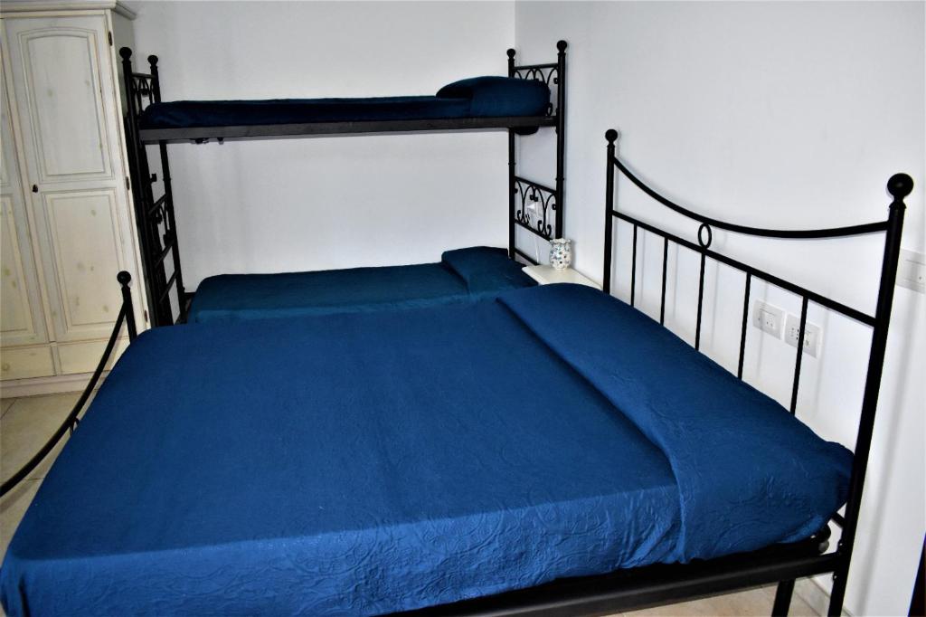 Postel nebo postele na pokoji v ubytování Casolare Azzurro