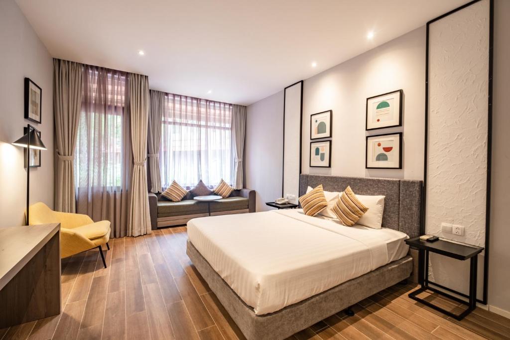 Seava Ho Tram Beach Resort tesisinde bir odada yatak veya yataklar