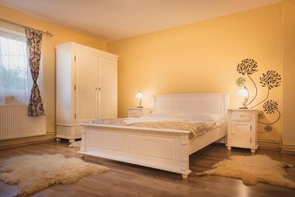 Postel nebo postele na pokoji v ubytování Casa Sasului
