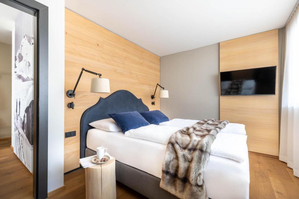 Postel nebo postele na pokoji v ubytování Sporthotel Chalet