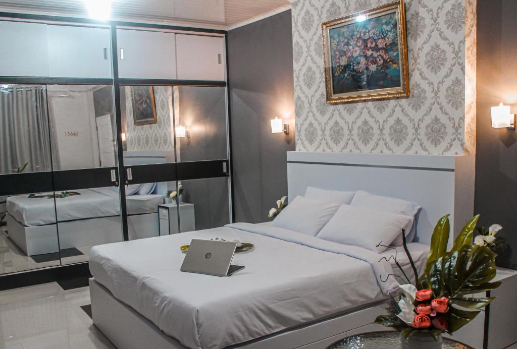 En eller flere senge i et værelse på BIN DAOD Hotel Syariah