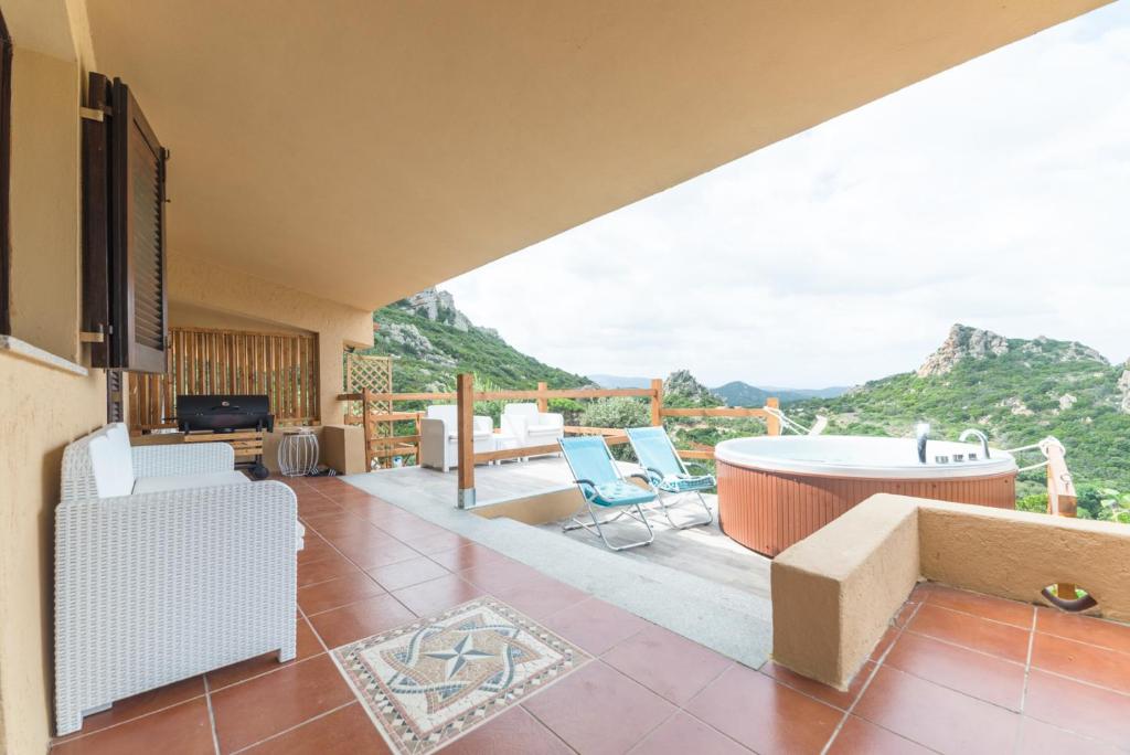 a living room with a view of the mountains at VILLA ALOE in Costa Paradiso