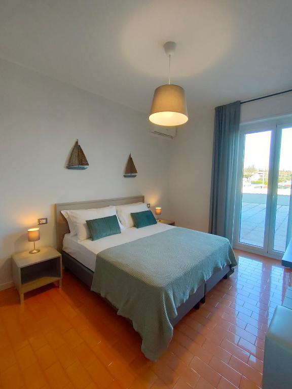 Postel nebo postele na pokoji v ubytování Albergo La Pescatrice