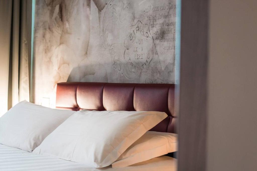 Postel nebo postele na pokoji v ubytování Hotel Cannaregio 2357