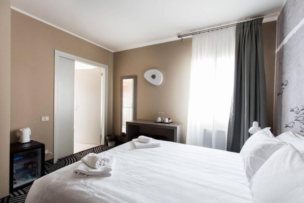 Postel nebo postele na pokoji v ubytování Hotel Cannaregio 2357