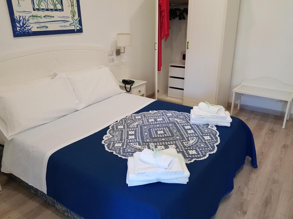 Postel nebo postele na pokoji v ubytování Hotel Oriente