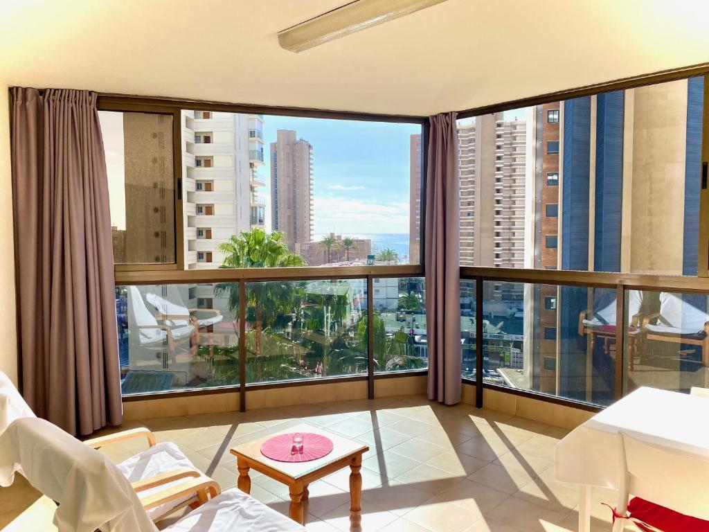 a living room with a large window with a view at Torpa - Aloturin Benidorm in Benidorm