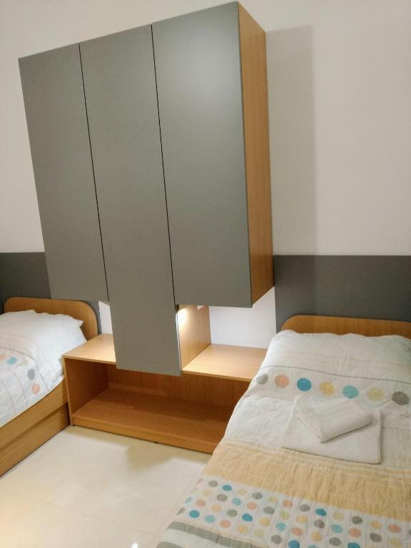 Postel nebo postele na pokoji v ubytování Apartmani Ines