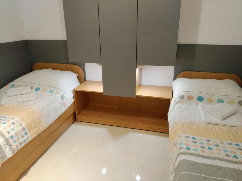 Postel nebo postele na pokoji v ubytování Apartmani Ines