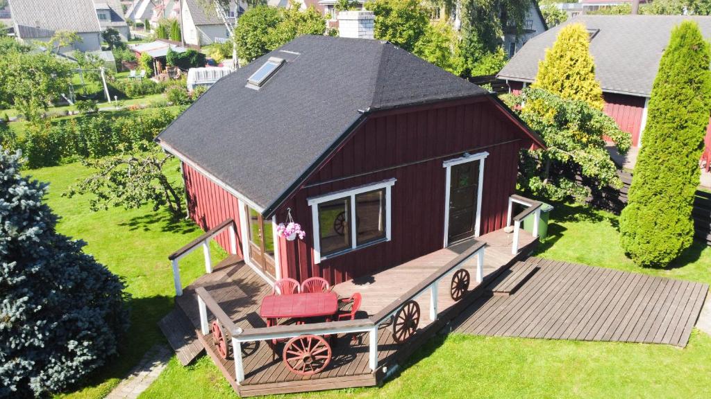 an overhead view of a small red house with a porch at Teeny in Pärnu