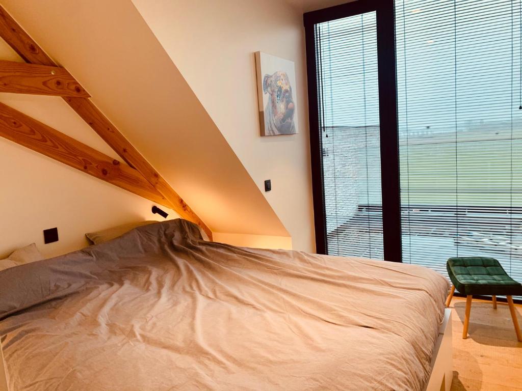 Postel nebo postele na pokoji v ubytování Koekeloeren