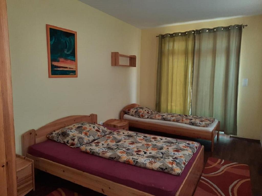 Posteľ alebo postele v izbe v ubytovaní Ponty Orsó Vendégház