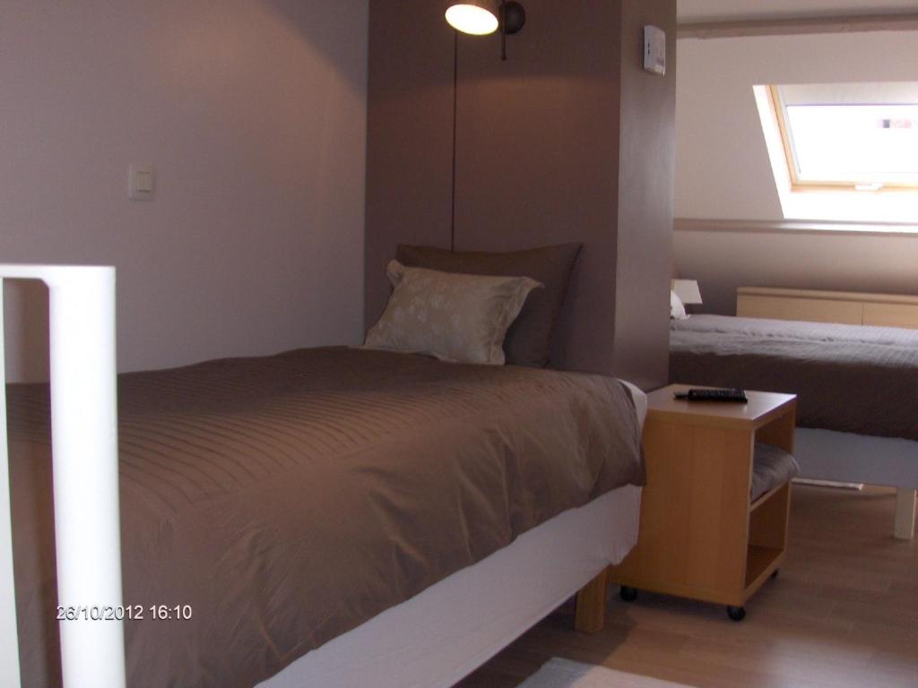 Postel nebo postele na pokoji v ubytování Wenceslas Cobergher